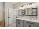 Bathroom features a double vanity with dark hardware and decor lighting at 14729 Erica Ln, Carmel, IN 46033