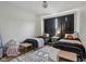 Inviting bedroom featuring two metal beds, a black and white rug, and soft pink accents at 14729 Erica Ln, Carmel, IN 46033
