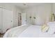 Bedroom featuring white bedding, a decorative throw, and updated light fixture, perfect for relaxation at 14729 Erica Ln, Carmel, IN 46033