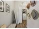 Hallway with hats on the wall and a bench in front of a closet with organizers at 14729 Erica Ln, Carmel, IN 46033