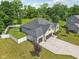 Well-manicured home featuring a three car garage, white fence, and beautifully landscaped yard at 14729 Erica Ln, Carmel, IN 46033