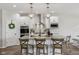 Stylish kitchen featuring a center island with pendant lighting, granite countertops, and stainless steel appliances at 14729 Erica Ln, Carmel, IN 46033