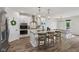 Bright open kitchen with a granite island, stainless steel appliances, and a spacious dining area for entertaining at 14729 Erica Ln, Carmel, IN 46033