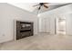 Bedroom showcasing neutral carpet, a fireplace, and a double-door closet with easy access to other areas at 1515 Randall Rd, Indianapolis, IN 46240
