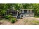 Charming two-story home with screened-in porch and landscaped yard at 1515 Randall Rd, Indianapolis, IN 46240