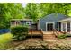 Charming backyard showing a wooden deck, pond and waterfall at 1515 Randall Rd, Indianapolis, IN 46240