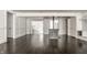 Spacious living room features dark hardwood floors, white trim, and fireplace, creating a bright and inviting atmosphere at 1515 Randall Rd, Indianapolis, IN 46240