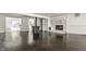 Bright living room with beautiful hardwood floors and a white painted brick fireplace, perfect for gatherings at 1515 Randall Rd, Indianapolis, IN 46240