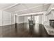 Open-concept living room with fireplace and dark hardwood floors at 1515 Randall Rd, Indianapolis, IN 46240