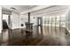 Bright living room with fireplace, dark hardwood floors, coffered ceilings, and natural light at 1515 Randall Rd, Indianapolis, IN 46240