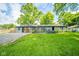 Expansive backyard featuring a well-maintained lawn and a cozy patio area perfect for outdoor entertaining at 1605 Westlane Rd, Indianapolis, IN 46260