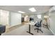 Finished basement featuring home office setup with desk and comfortable seating at 1605 Westlane Rd, Indianapolis, IN 46260