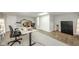 Spacious basement with a functional home office setup and ample lighting at 1605 Westlane Rd, Indianapolis, IN 46260