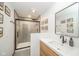 Modern bathroom with walk-in shower, floating vanity, and stylish fixtures creates a spa-like retreat at 1605 Westlane Rd, Indianapolis, IN 46260