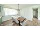 Bright dining room with stylish lighting, modern table set, and elegant window at 1605 Westlane Rd, Indianapolis, IN 46260