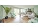 Spacious living room filled with natural light with a large window and sliding glass door at 1605 Westlane Rd, Indianapolis, IN 46260