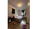 Bedroom showcasing natural lighting, hardwood floors, and a ceiling light at 1728 N Somerset Ave, Indianapolis, IN 46222