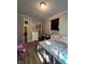 Bedroom featuring hardwood floors, a ceiling light, neutral wall color, and an air conditioner at 1728 N Somerset Ave, Indianapolis, IN 46222