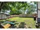 The backyard features a large tree, a wooden fence, a storage shed, and a camper at 1759 Michele Ln, Greenwood, IN 46142