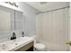 Bathroom featuring a modern vanity with stylish fixtures, sink, and a shower tub at 1759 Michele Ln, Greenwood, IN 46142