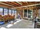 Enclosed sunroom patio with brick, ceiling fan, and concrete floor at 1759 Michele Ln, Greenwood, IN 46142