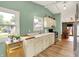Bright kitchen featuring white cabinets, stainless steel appliances, and hardwood floors at 1759 Michele Ln, Greenwood, IN 46142