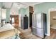 Modern kitchen with stainless steel appliances, ample counter space, and an open view to the dining area at 1759 Michele Ln, Greenwood, IN 46142