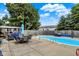 In-ground swimming pool with patio area and outdoor seating, perfect for relaxation and entertaining at 1759 Michele Ln, Greenwood, IN 46142