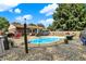 Spacious backyard with in-ground swimming pool, patio area, and low-maintenance gravel landscaping at 1759 Michele Ln, Greenwood, IN 46142