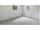 Cozy bedroom with neutral walls and carpet and lots of natural light at 1933 Tallman Ave, Indianapolis, IN 46218