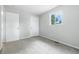 Bright bedroom featuring two doors, gray carpet and ample natural light at 1933 Tallman Ave, Indianapolis, IN 46218