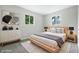 Bright bedroom with wood furnishings, natural light, and a plush area rug at 1933 Tallman Ave, Indianapolis, IN 46218