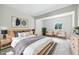 Calm and inviting main bedroom featuring stylish furniture, soft rug and ample natural light creates a restful atmosphere at 1933 Tallman Ave, Indianapolis, IN 46218