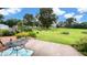 Expansive backyard features a beautiful patio, lush lawn, and colorful flower beds at 202 Collier St, Columbus, IN 47201