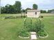Lush vegetable garden and useful shed, featuring a vibrant mix of greenery with plenty of space for gardening and outdoor enjoyment at 202 Collier St, Columbus, IN 47201