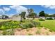 View of the backyard featuring a shed, a garden area with a decorative fence, and lush greenery, ideal for gardening at 202 Collier St, Columbus, IN 47201