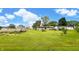 Expansive backyard showcasing a well-kept lawn, perfect for outdoor activities, along with a shed and garden area at 202 Collier St, Columbus, IN 47201
