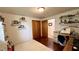 Charming bedroom with hardwood floors, shelving, and ample storage, creating a cozy atmosphere perfect for rest and relaxation at 202 Collier St, Columbus, IN 47201