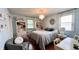 Serene bedroom with elegant chandelier, light blue walls, and decorative accents, creating a restful and inviting retreat at 202 Collier St, Columbus, IN 47201