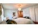 Bright bedroom featuring a mirrored vanity, neutral walls, and natural light, creating a serene and comfortable atmosphere at 202 Collier St, Columbus, IN 47201