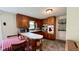 Traditional kitchen with wood cabinets, eat-in breakfast bar, and updated appliances at 202 Collier St, Columbus, IN 47201