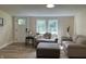 Inviting living room featuring wood-look flooring, neutral decor, and plenty of natural light, perfect for relaxation at 221 N 9Th St, Elwood, IN 46036