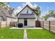 Charming home with a well-manicured backyard, patio, and black trim on the exterior at 3035 Guilford Ave, Indianapolis, IN 46205