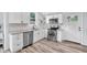 Modern kitchen with stainless steel appliances, granite countertops, and white cabinets at 3035 Guilford Ave, Indianapolis, IN 46205