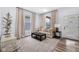 Bright and airy living room featuring two large windows, neutral paint, and hardwood floors at 3035 Guilford Ave, Indianapolis, IN 46205