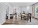 Open-concept living space showcasing stylish dining and living areas with modern furnishings and natural light at 3035 Guilford Ave, Indianapolis, IN 46205