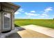 Private back patio with a brick home exterior and scenic views of the lush green lawn at 3072 W Glacier Dr, Monrovia, IN 46157