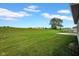 Expansive backyard with a well-maintained lawn and mature tree, ideal for outdoor enjoyment and recreation at 3072 W Glacier Dr, Monrovia, IN 46157