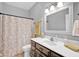 Bathroom features a vanity with framed mirror and decorative shower curtain at 3072 W Glacier Dr, Monrovia, IN 46157