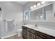 Bright bathroom with a modern vanity, a decorative mirror, and natural light from the window at 3072 W Glacier Dr, Monrovia, IN 46157